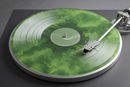 A Cloudy Green Vinyl Record on a Turntable From Above